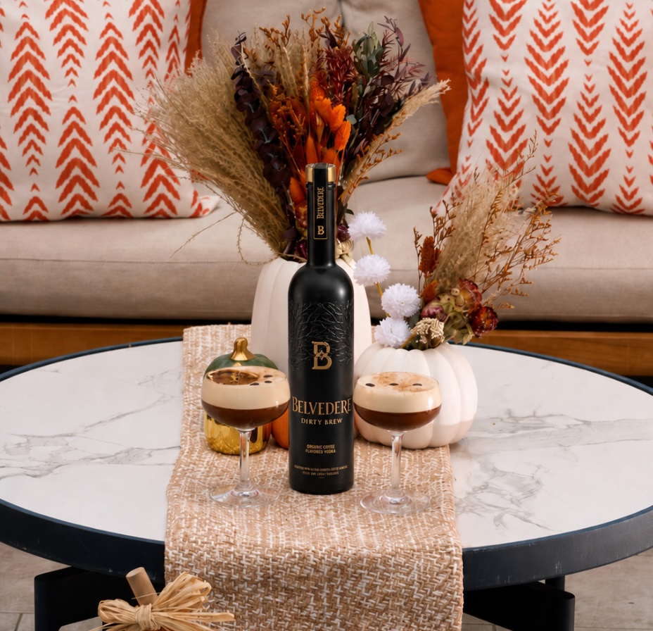 a table with wine glasses and a bottle of wine