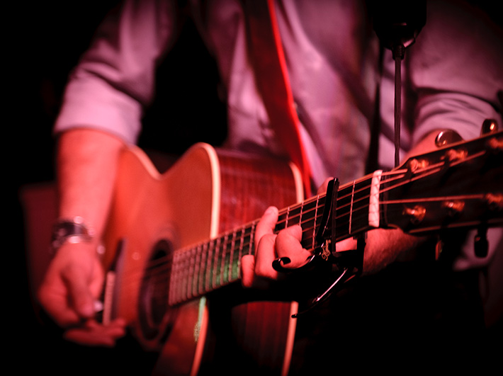a person playing a guitar
