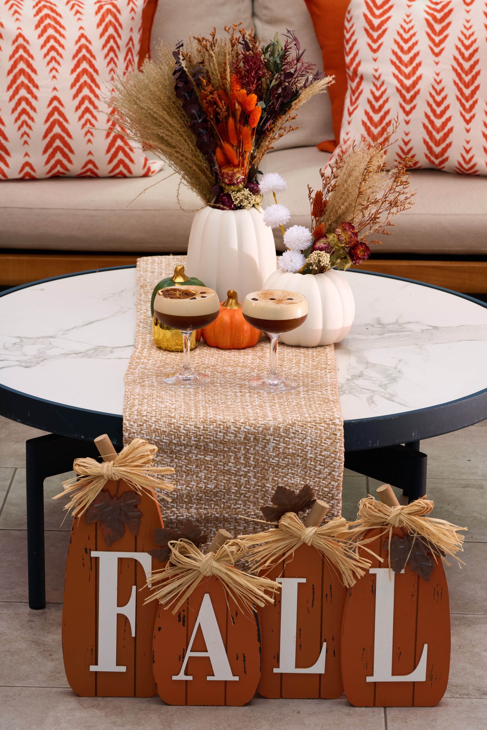 a table with a tablecloth and a vase of flowers