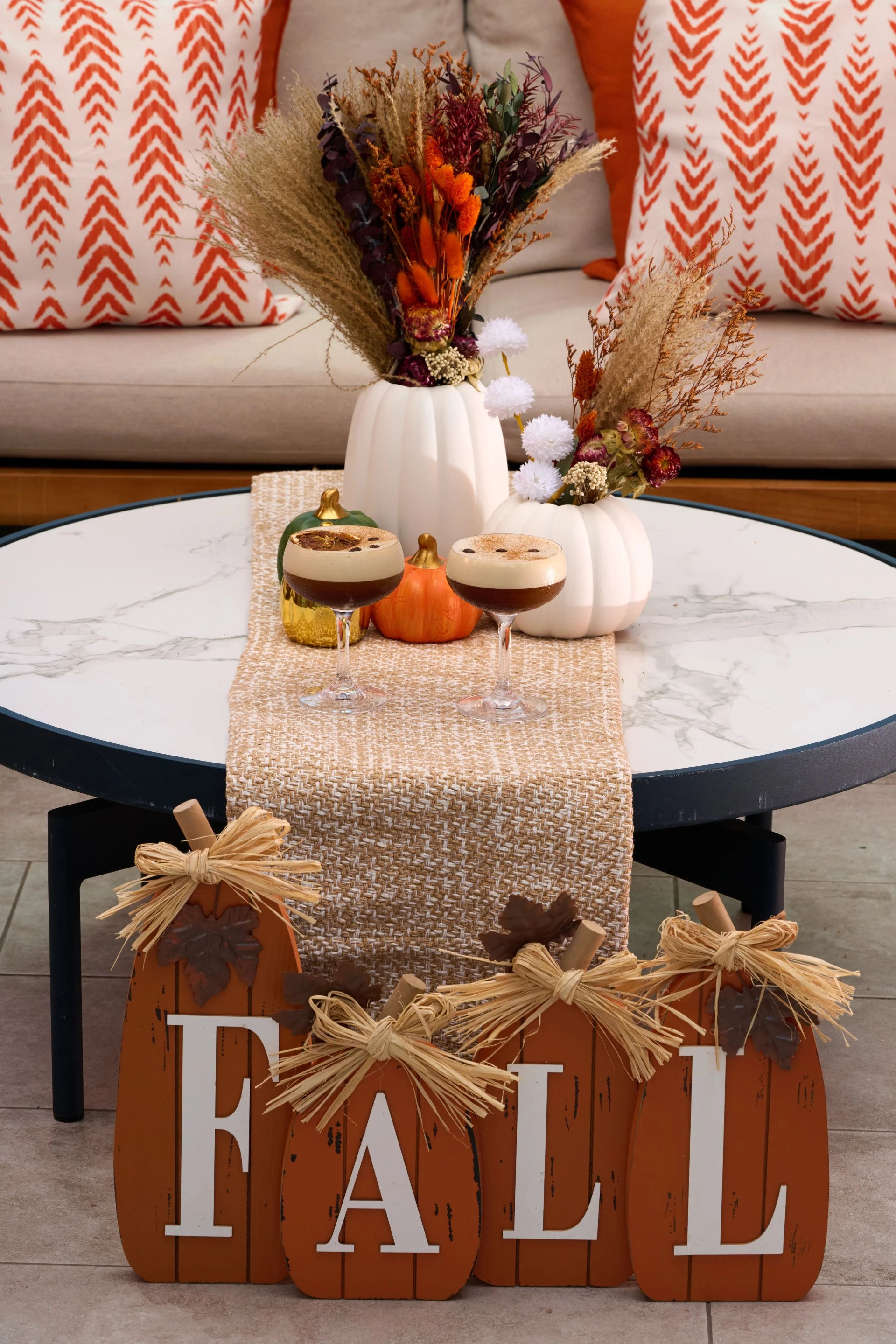 a table with a tablecloth and a vase of flowers