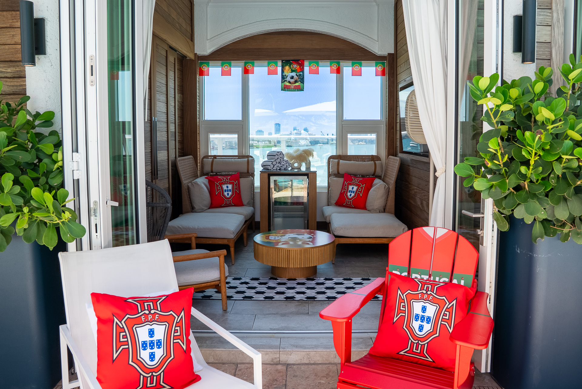 a patio with chairs and a table