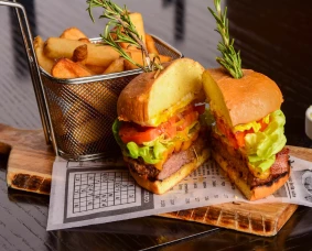 a burger and fries on a table