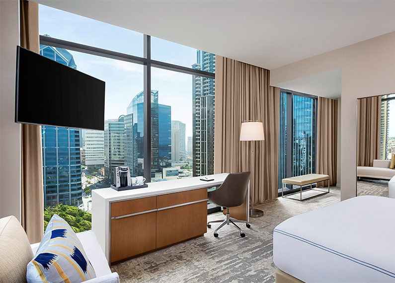 a room with a tv and a bed