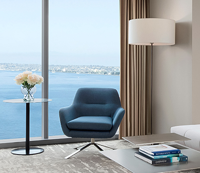 a room with a large window overlooking the water