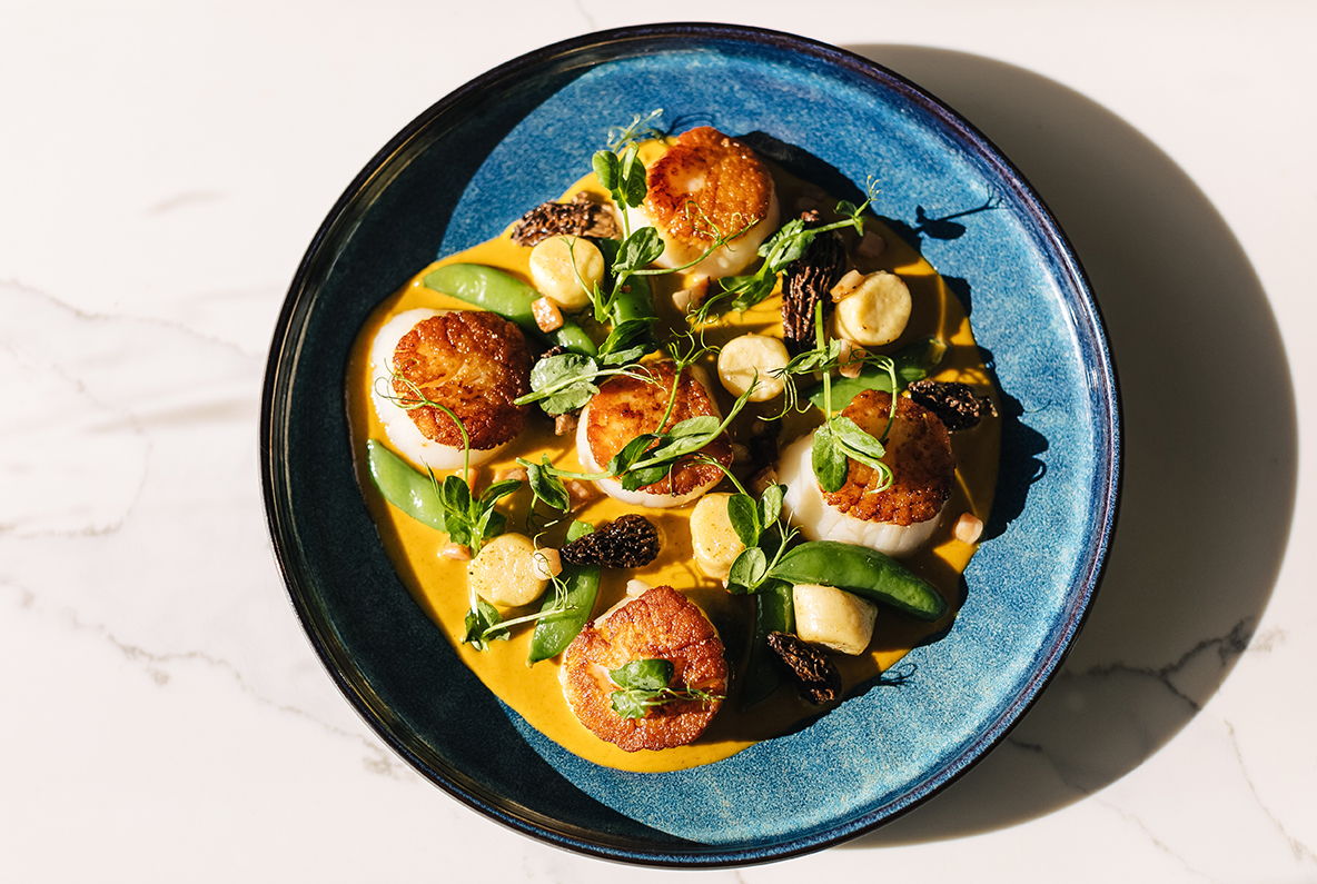 a plate of food on a marble surface