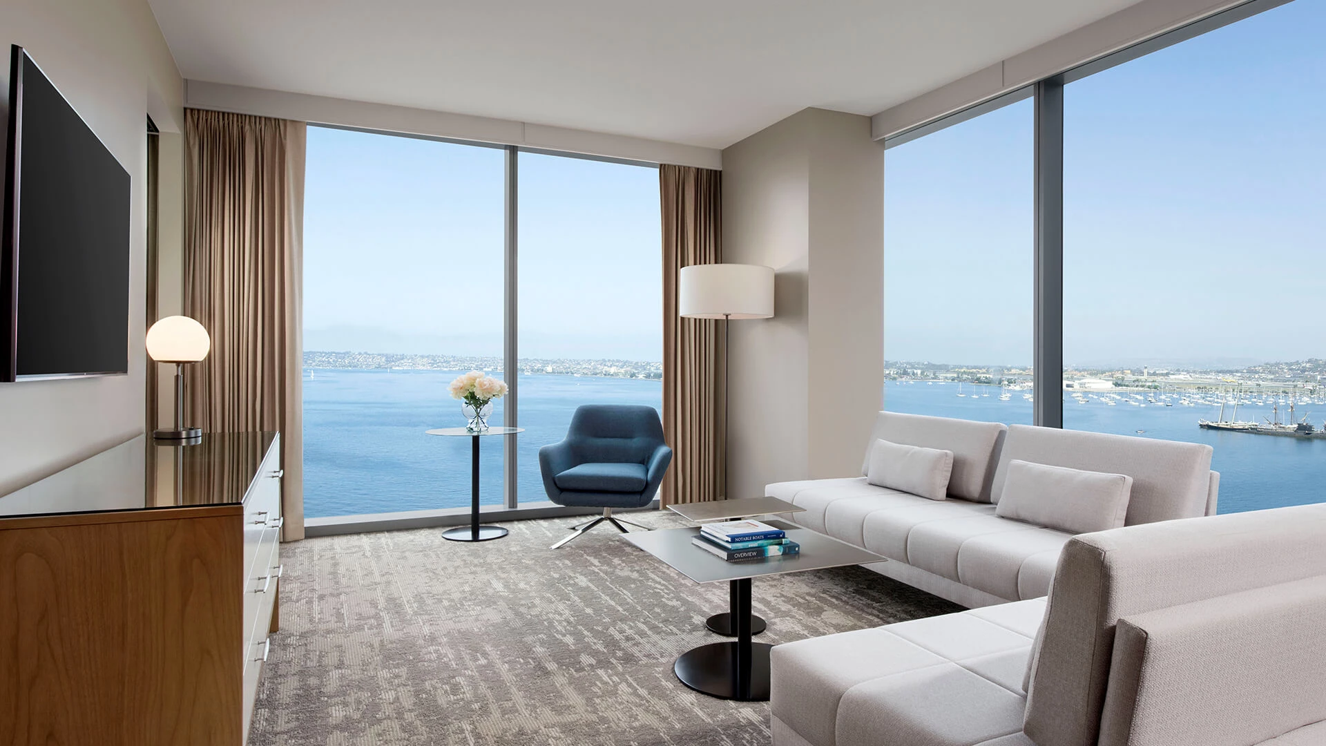 a room with a large window overlooking the water