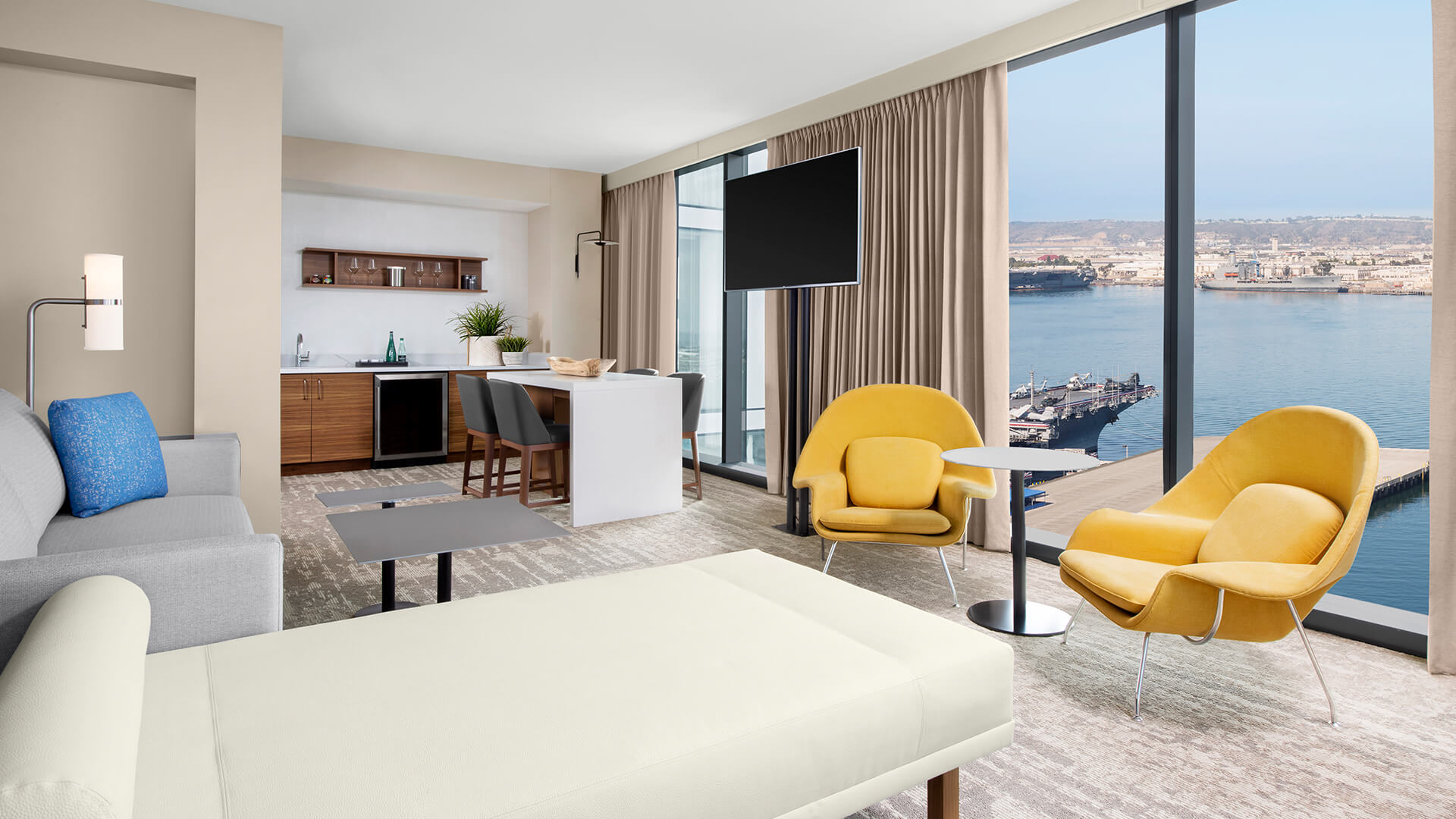 a room with a television and a table and chairs