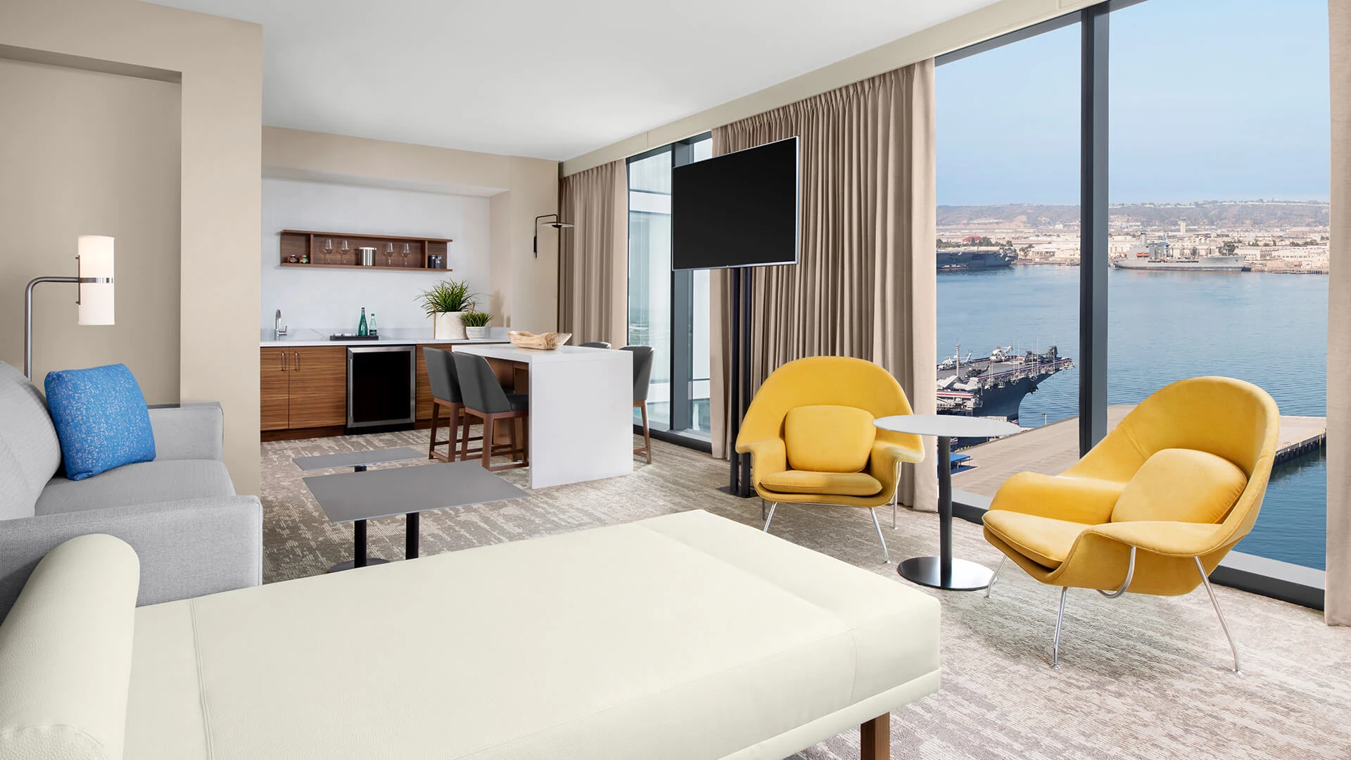a room with a television and a table and chairs