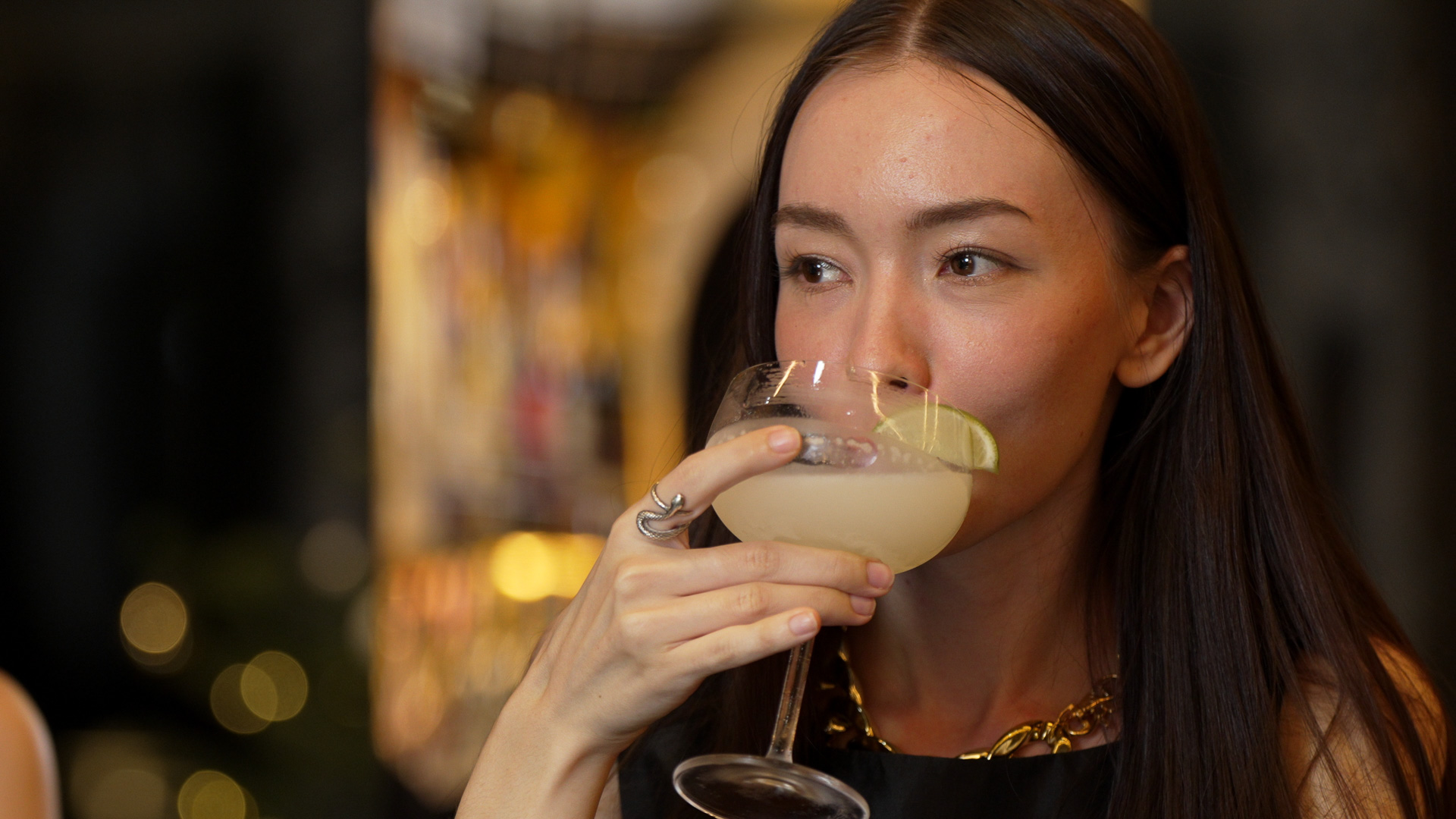 a woman drinking a drink