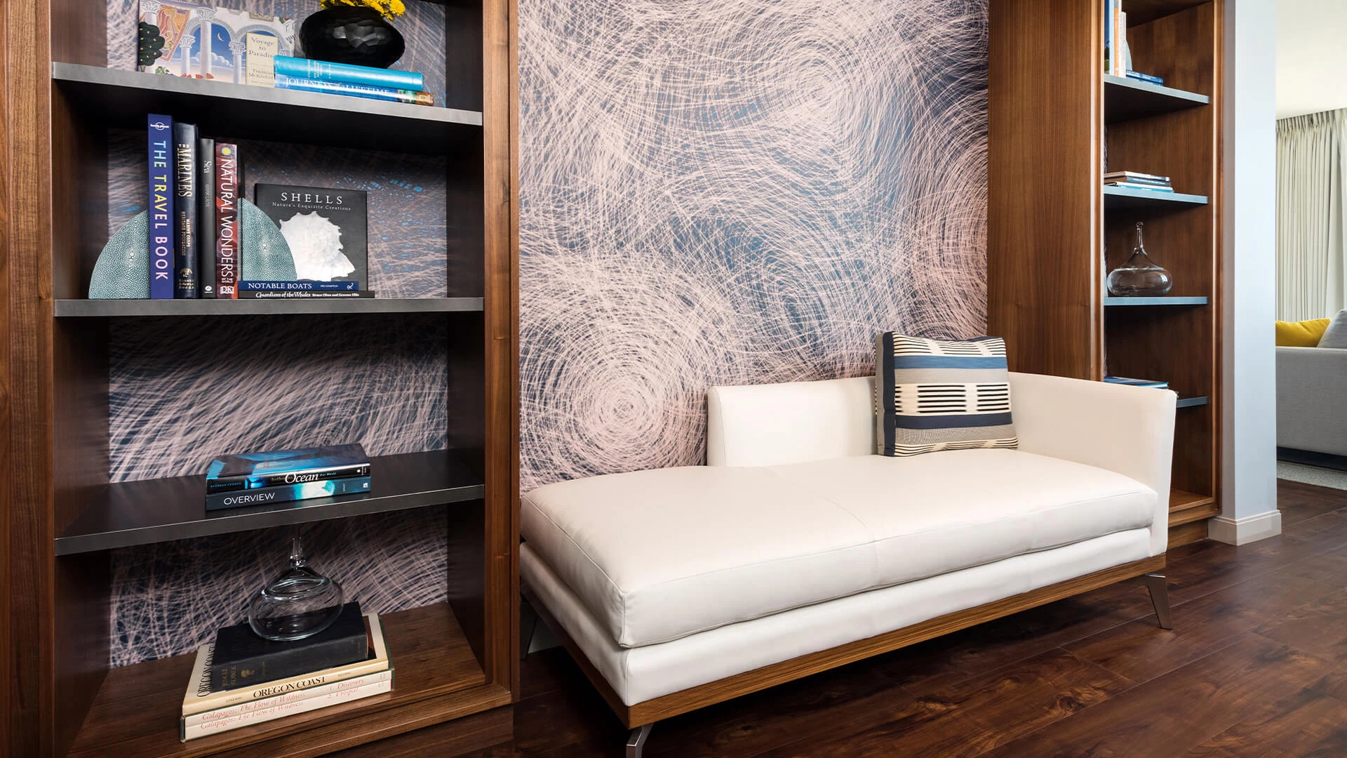 a white couch next to a shelf