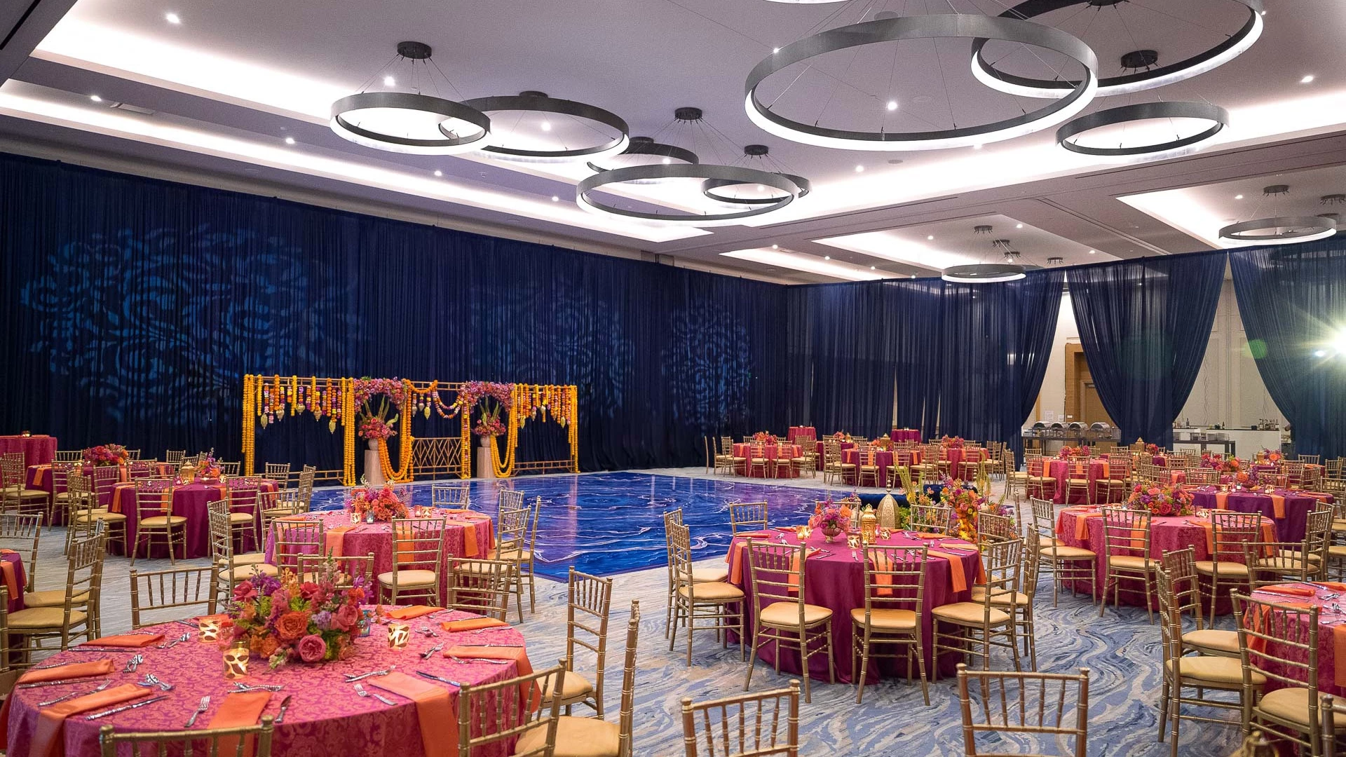 a large ballroom with tables and chairs