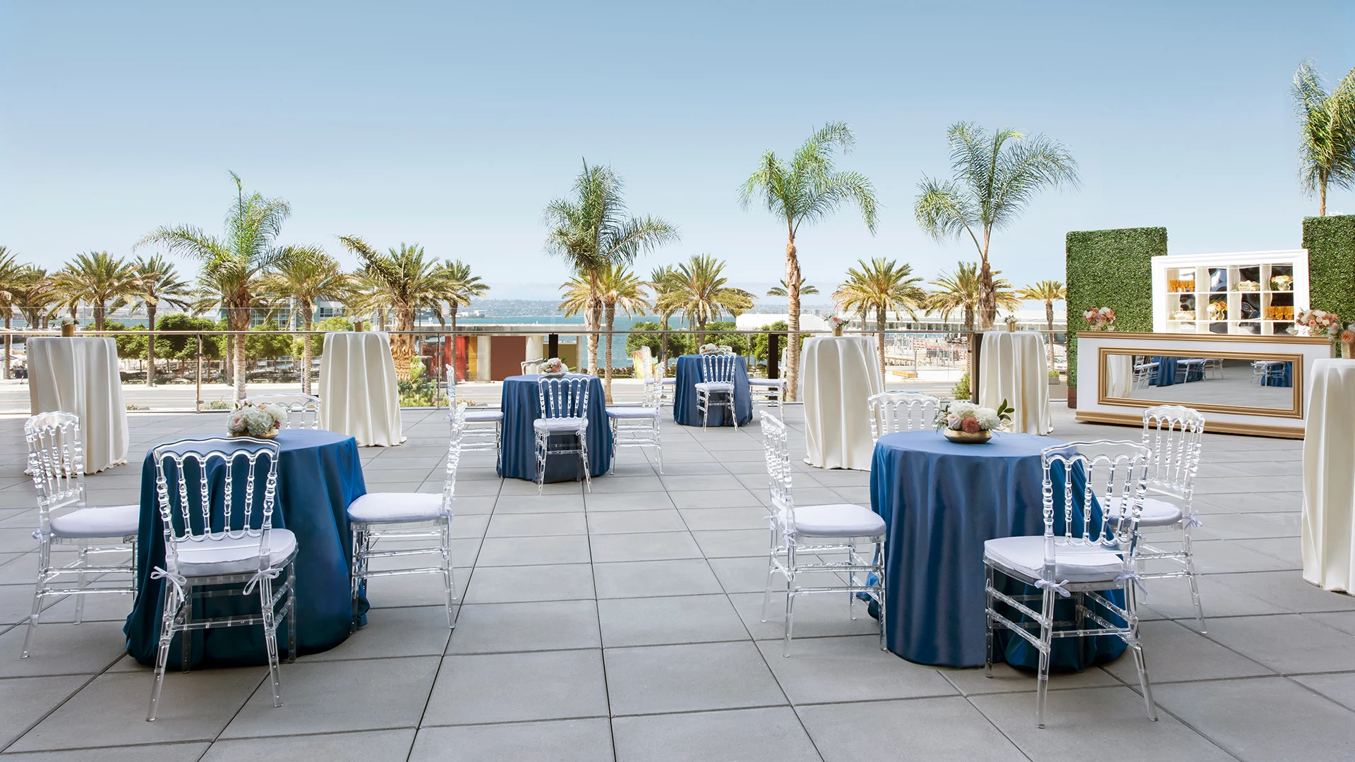 a group of tables and chairs on a patio