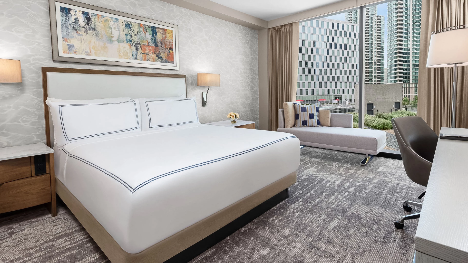 a hotel room with a bed and a couch