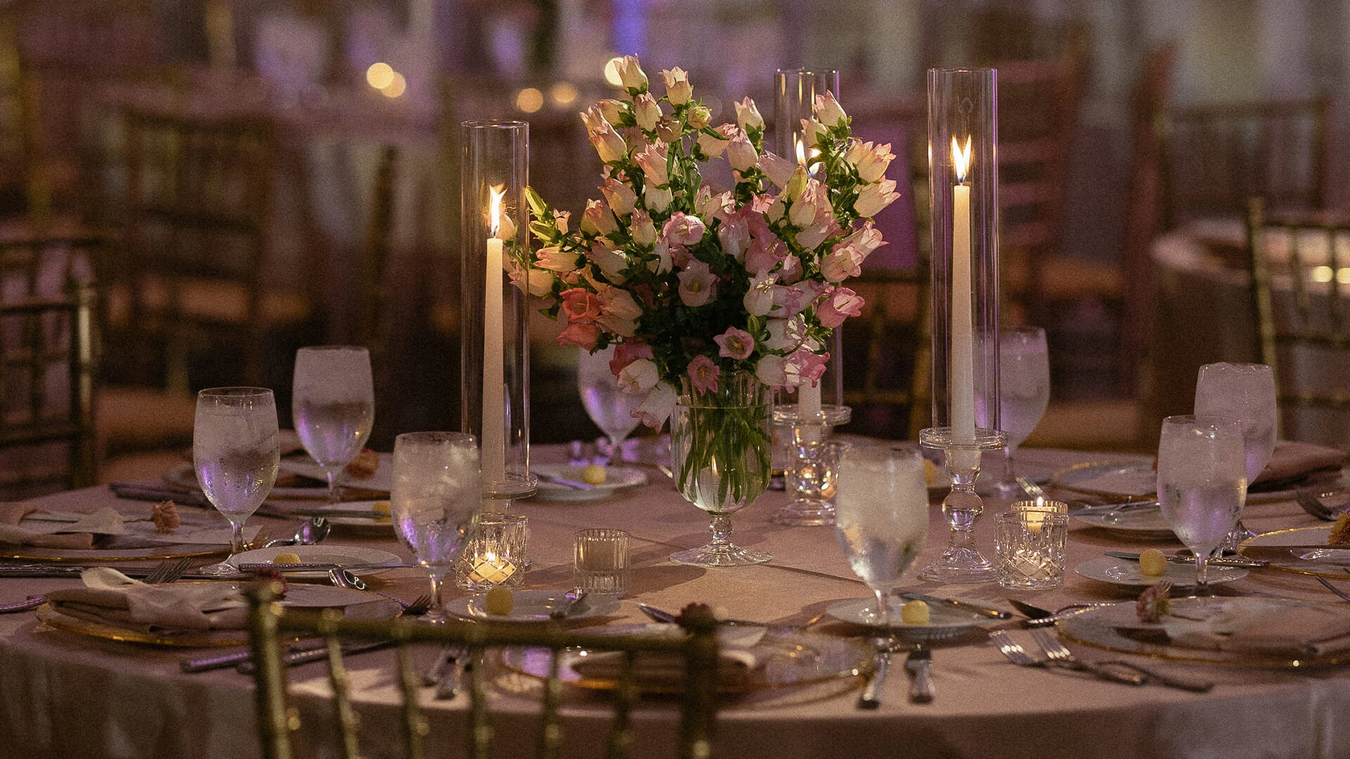 a table set with candles and flowers