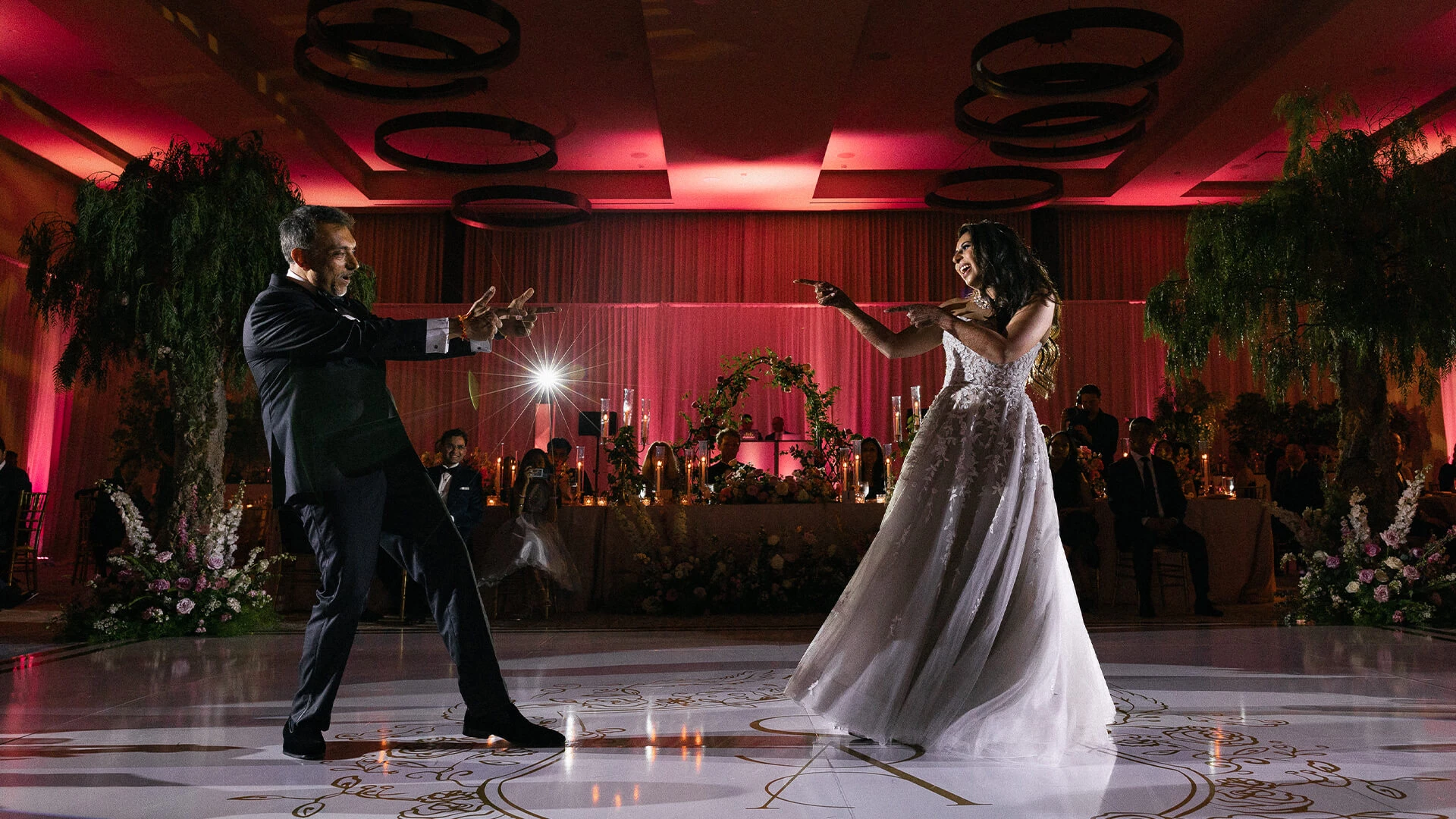 a man and woman dancing on a dance floor