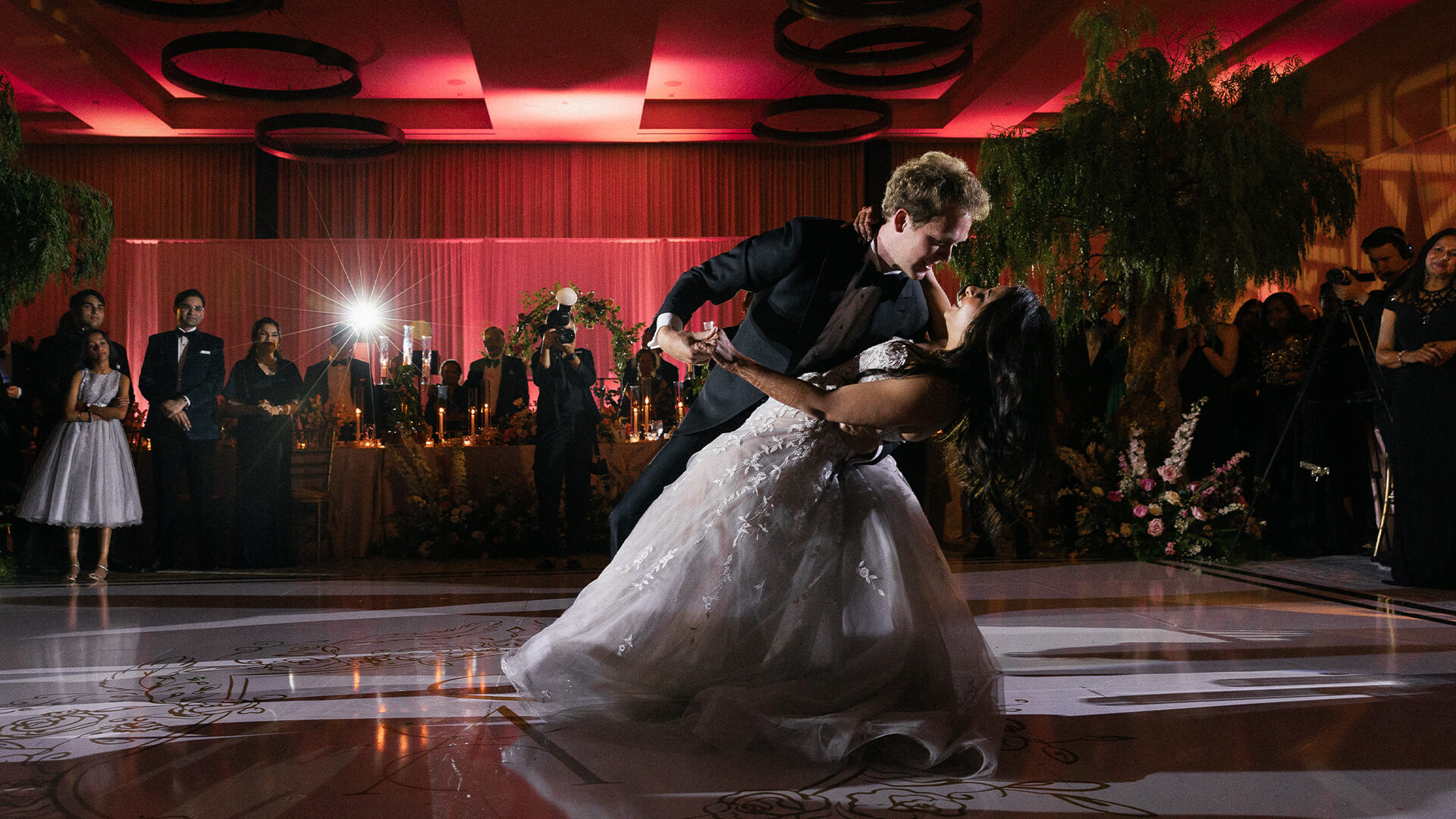 a man and woman dancing on a dance floor