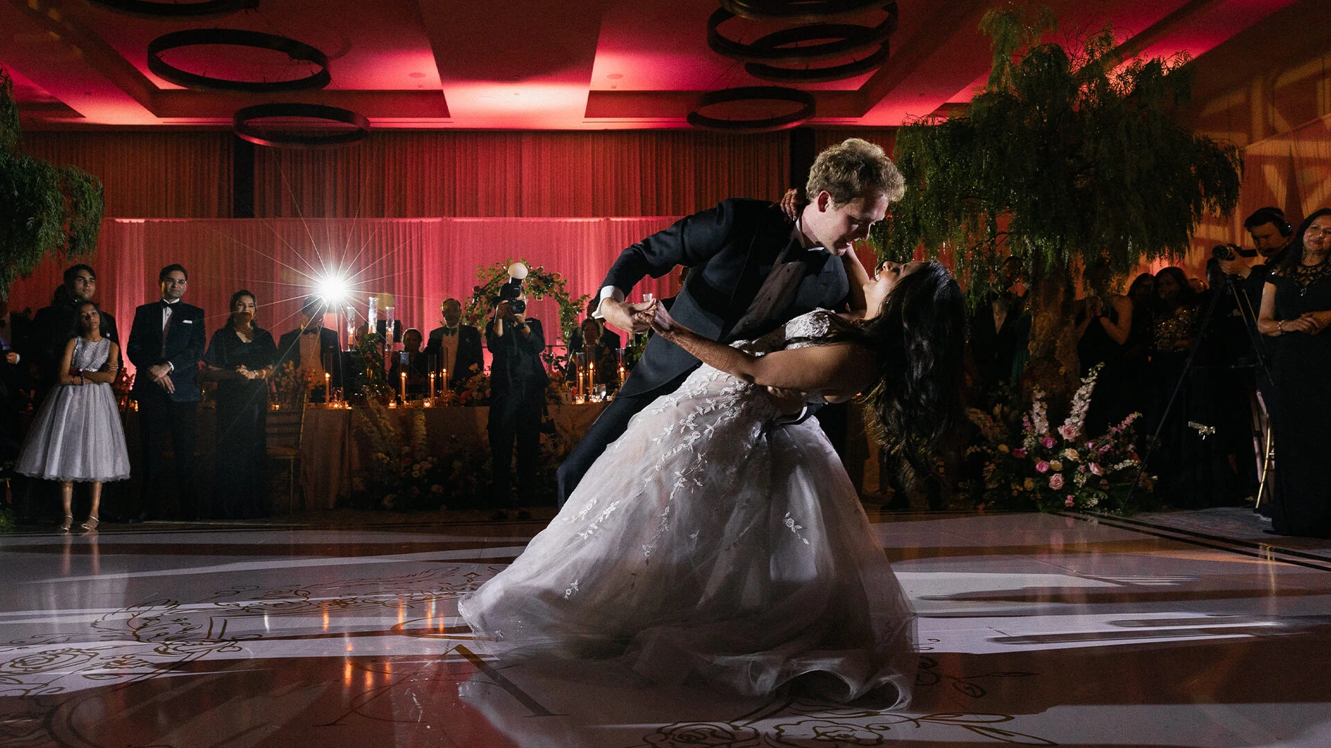 a man and woman dancing on a dance floor