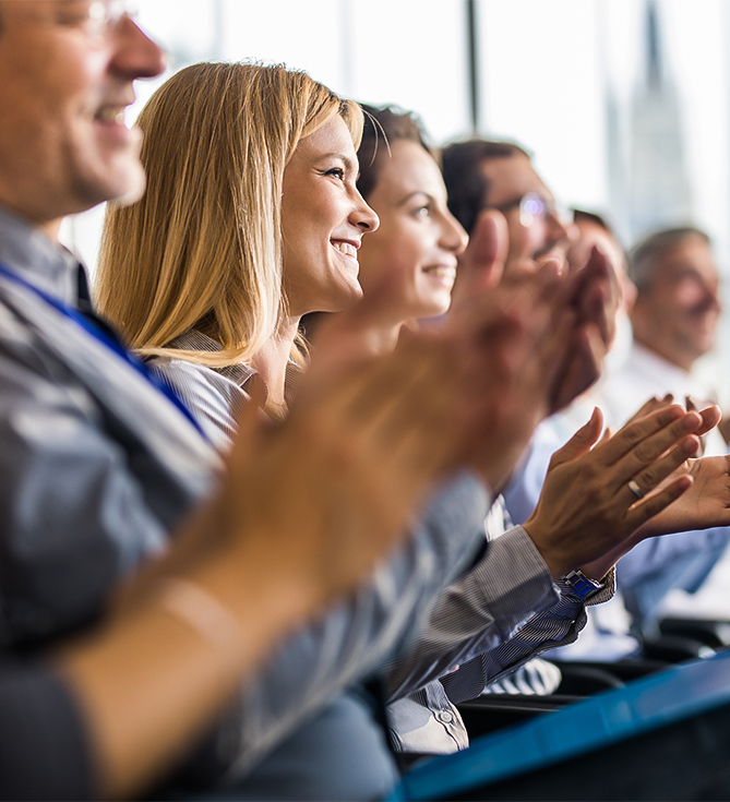 a group of people clapping