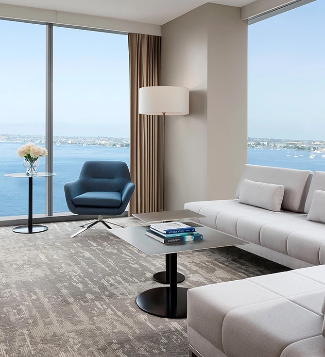 a room with a large window overlooking the water