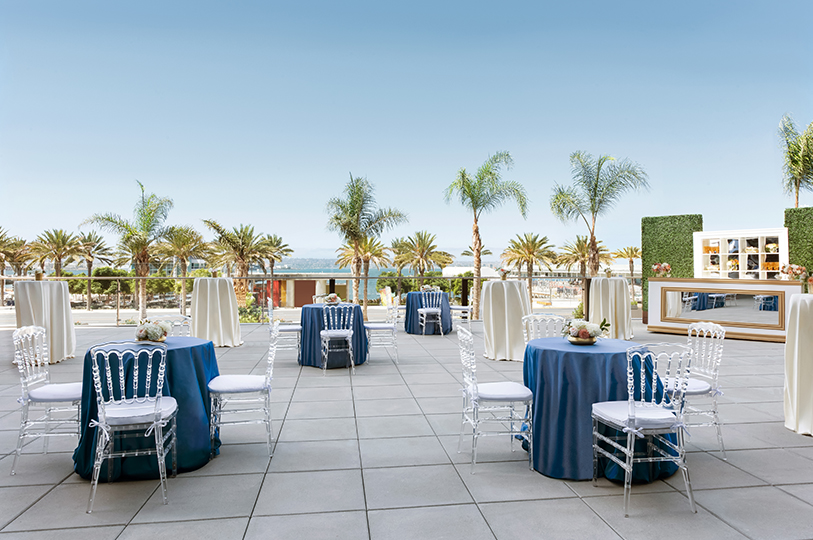 a group of tables and chairs on a patio