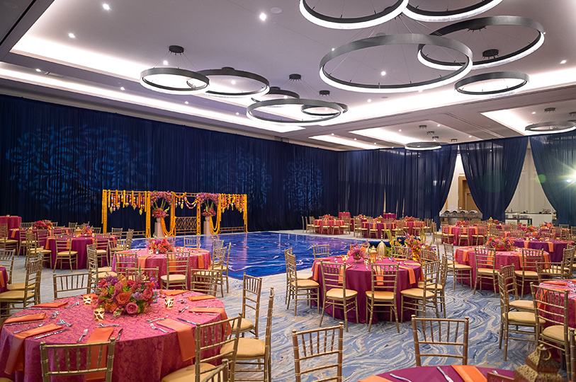 a large ballroom with tables and chairs