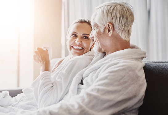 a man and woman in bathrobes