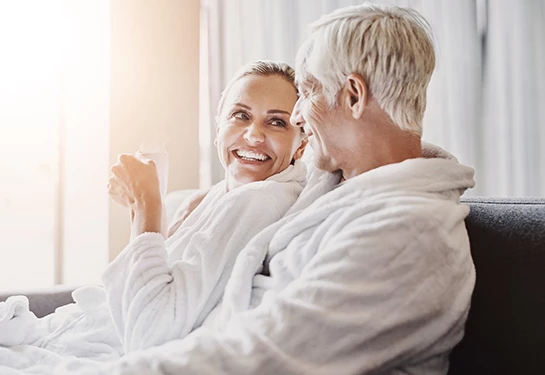 a man and woman in bathrobes