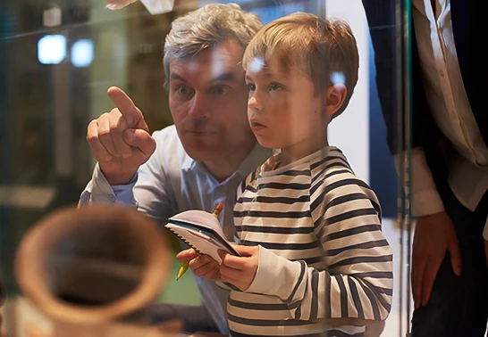 a man and boy looking at something