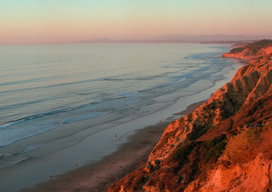 a beach with a body of water