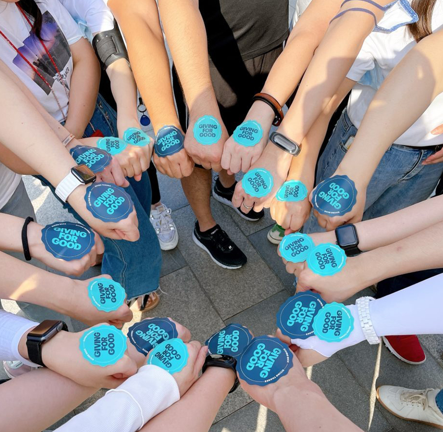 a group of people holding hands together