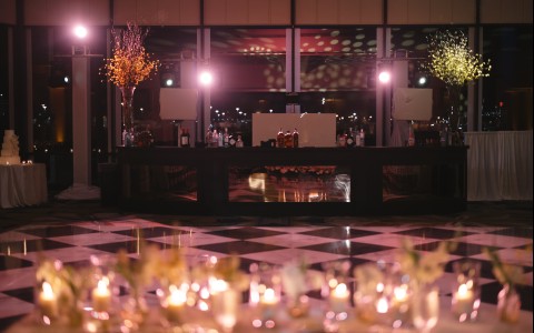 a bar with candles in front of it