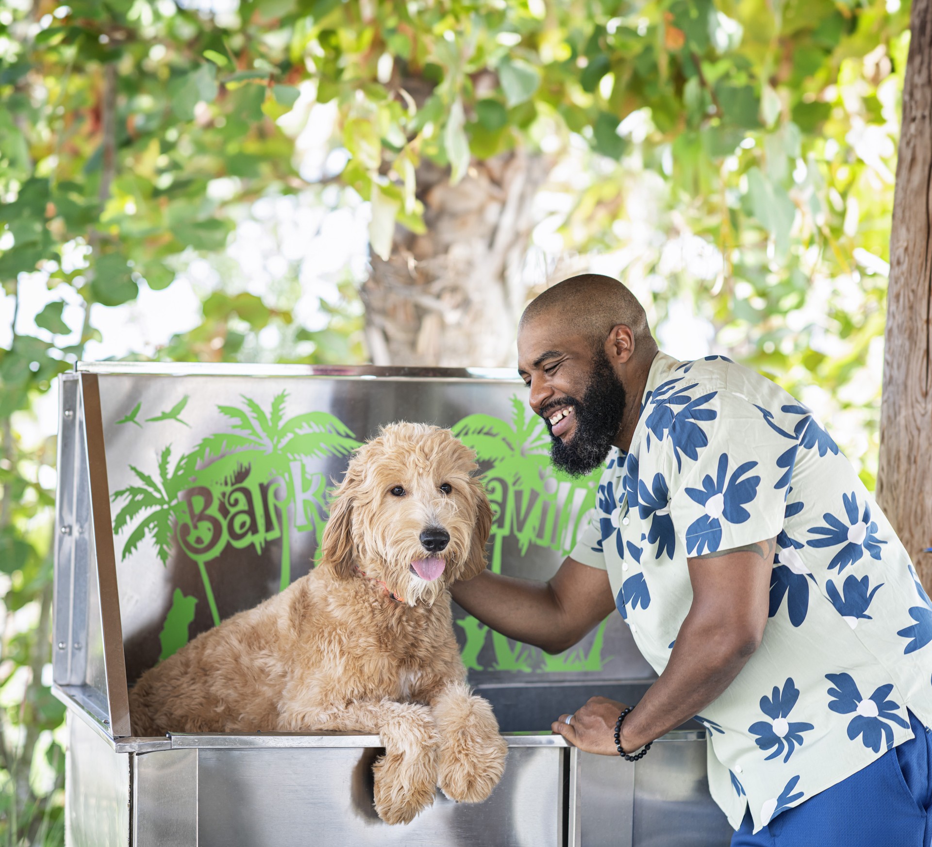 a man and dog in a metal box