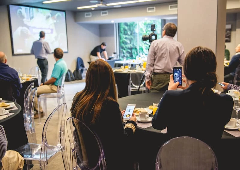 a group of people sitting at tables
