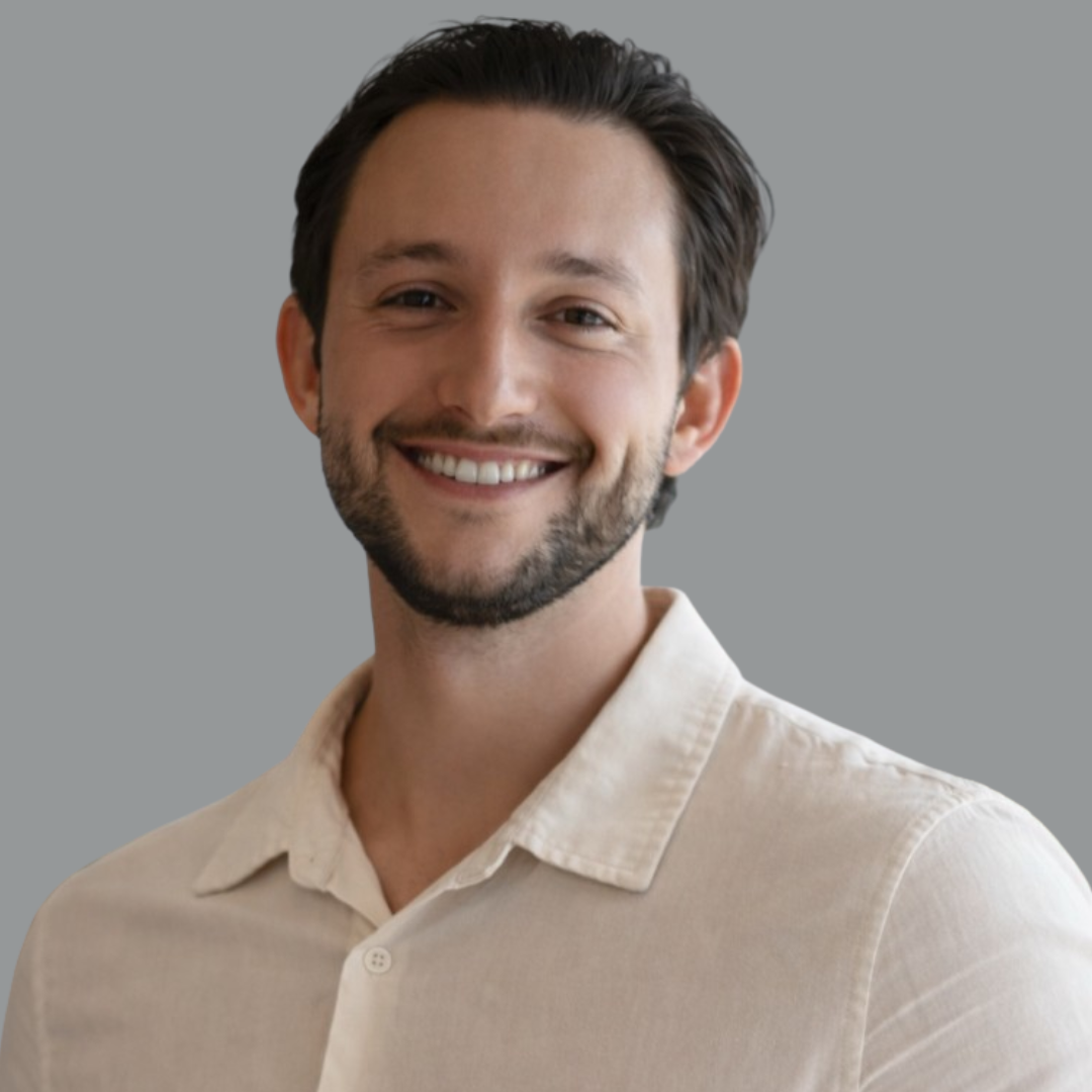 a man smiling at the camera