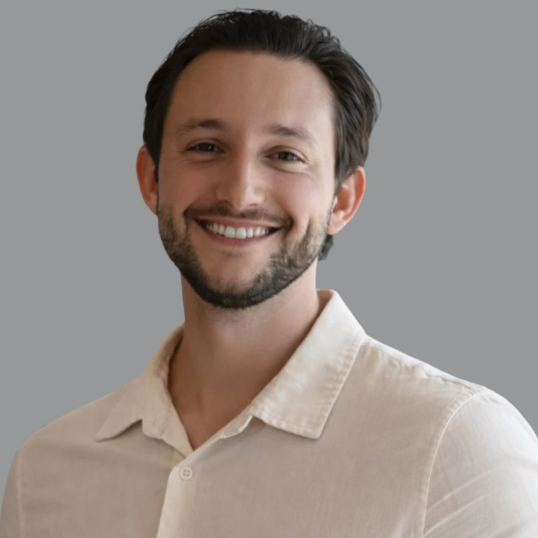 a man smiling at the camera