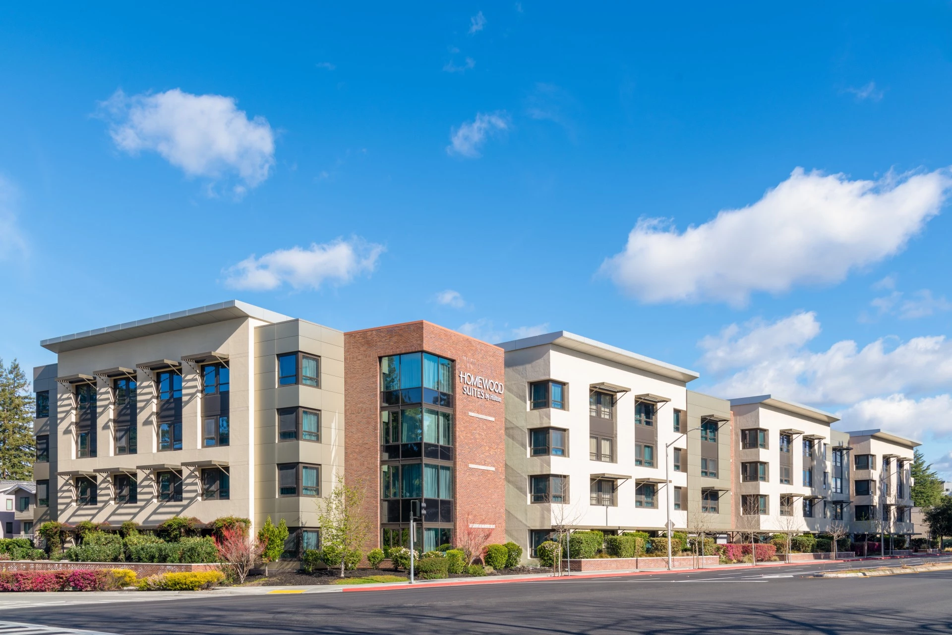 a building with a street and blue sky