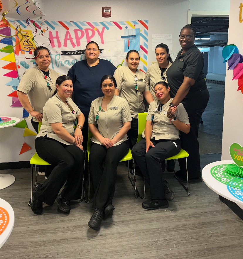 a group of women posing for a photo