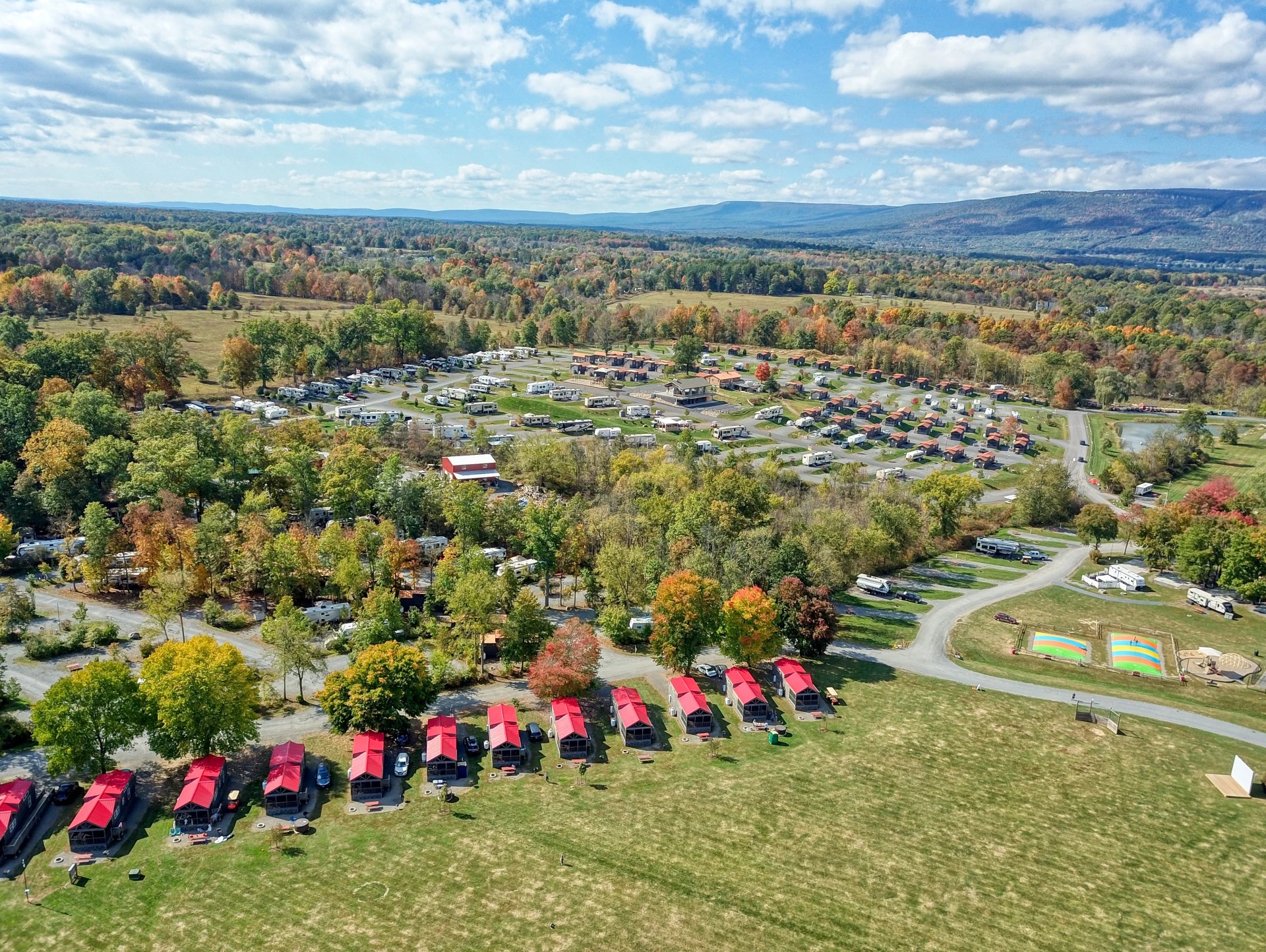 a parking lot with many red tents