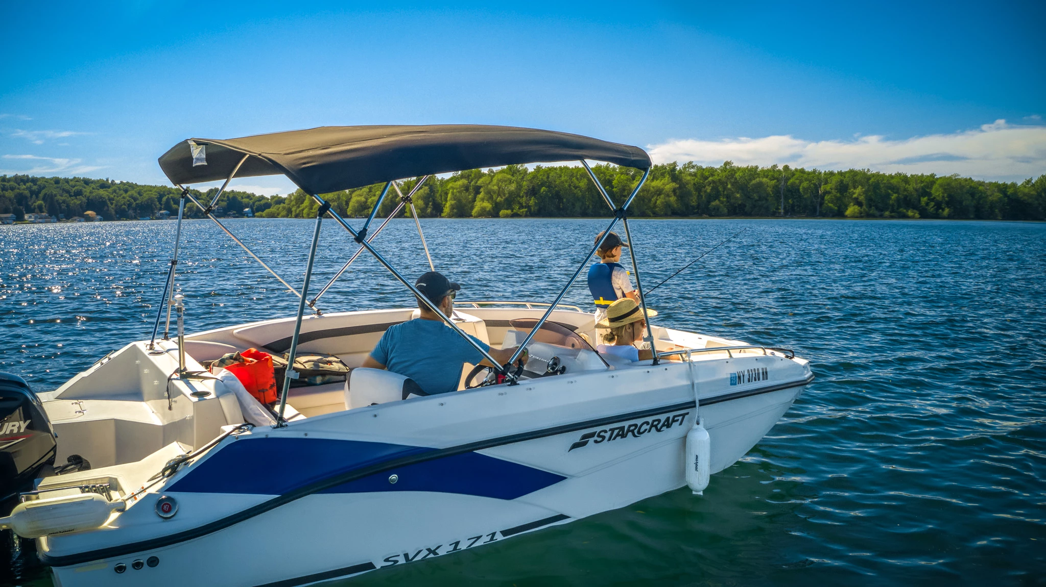 a group of people in a boat on the water