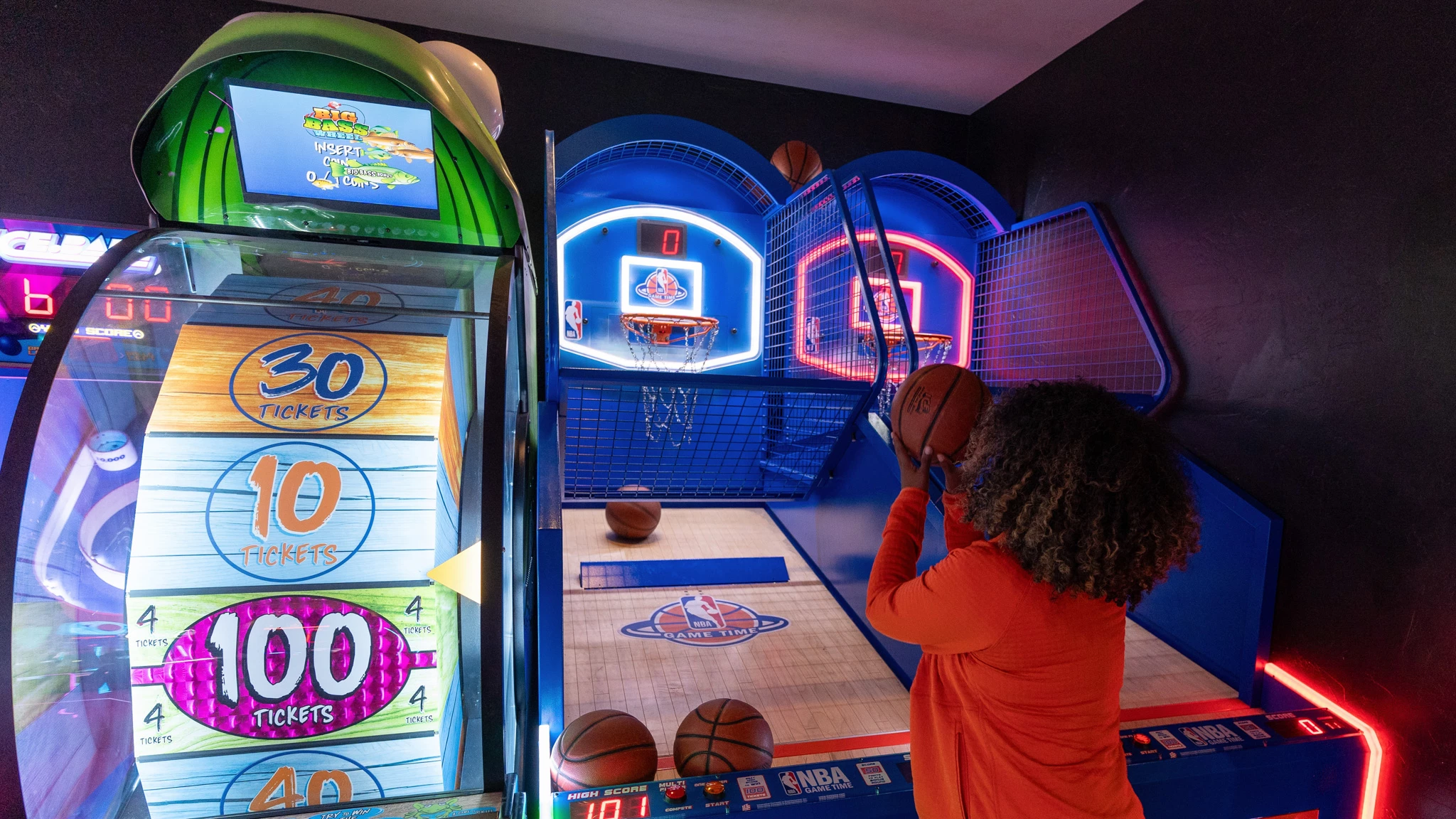 a woman shooting a basketball at a game