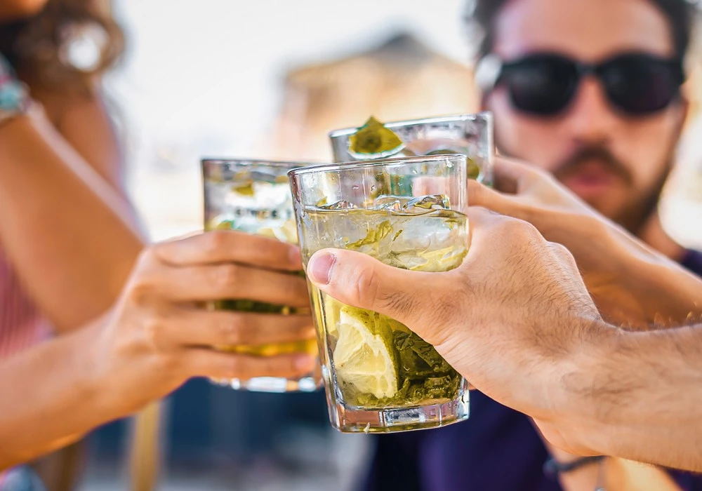 a group of people holding drinks