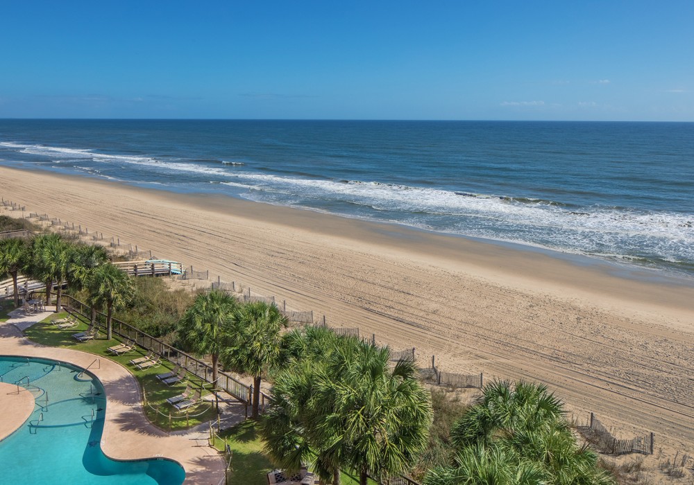a swimming pool on a beach