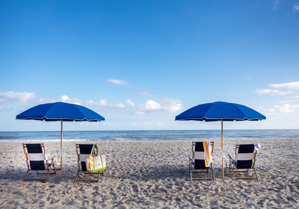 chairs and umbrellas on a beach