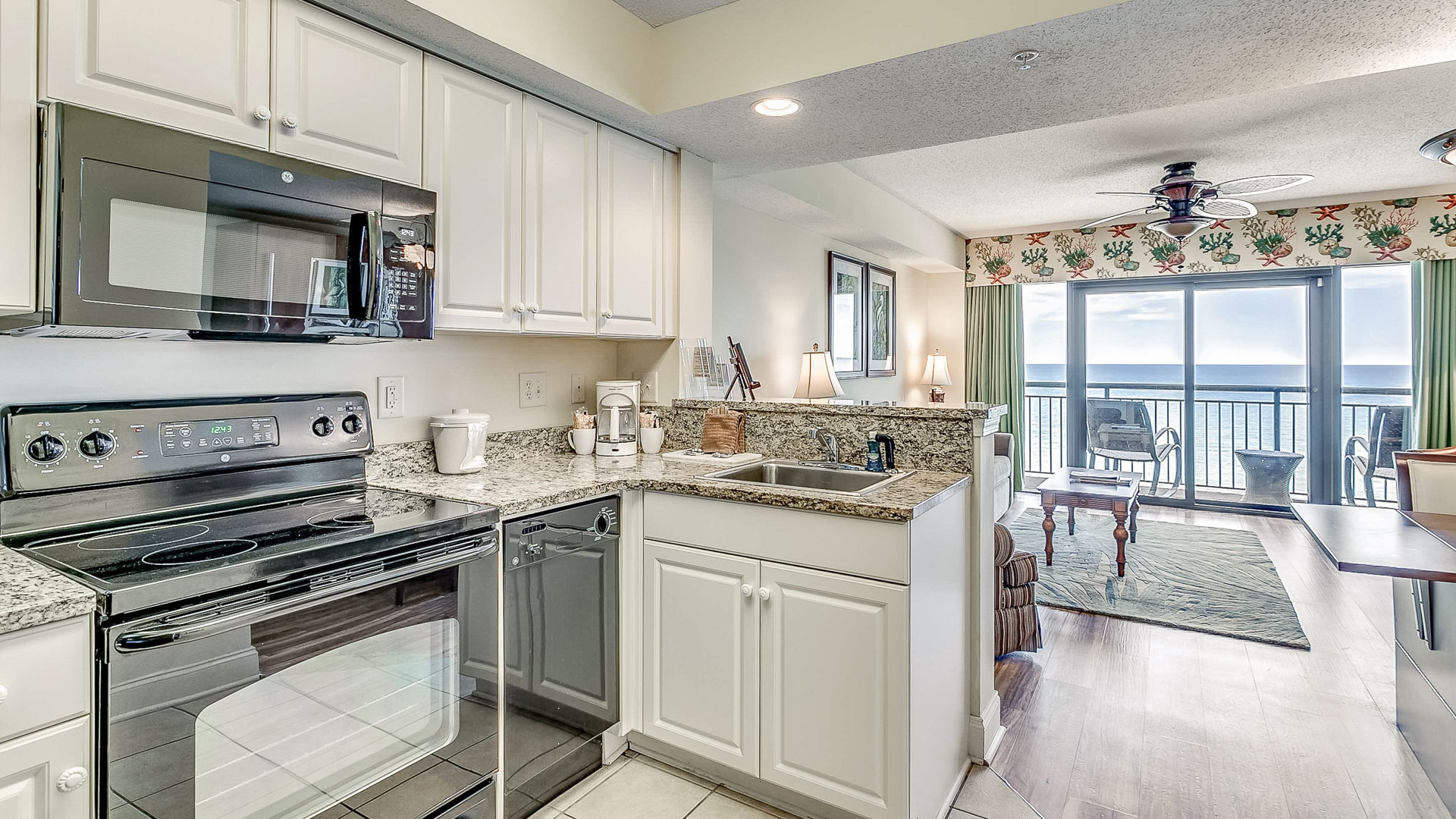 a kitchen with a view of the ocean