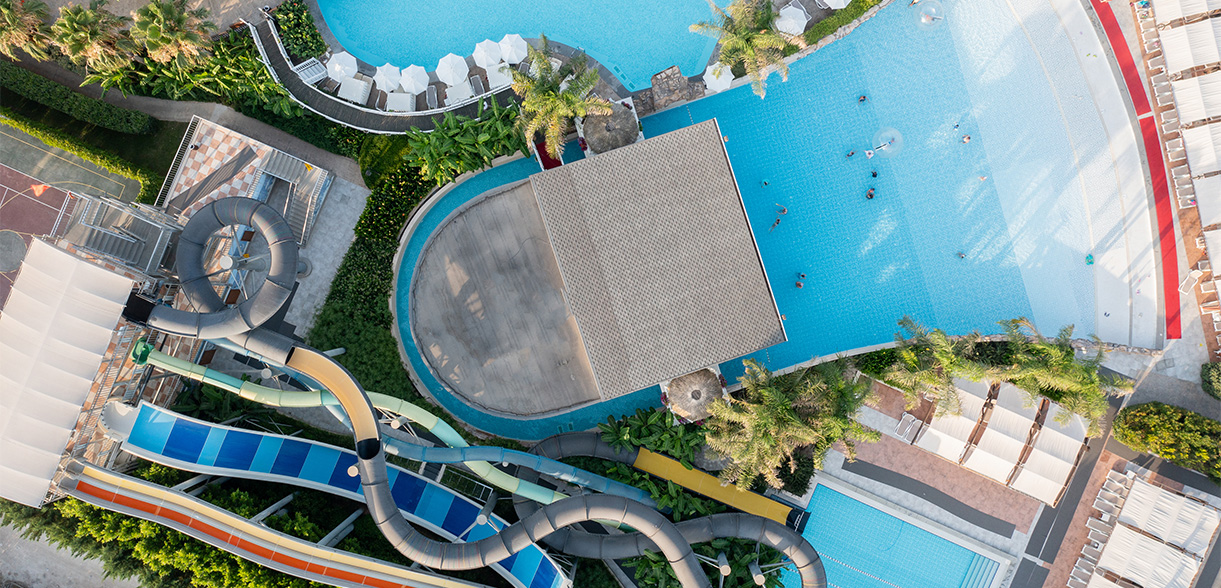 a water park with a slide and a pool