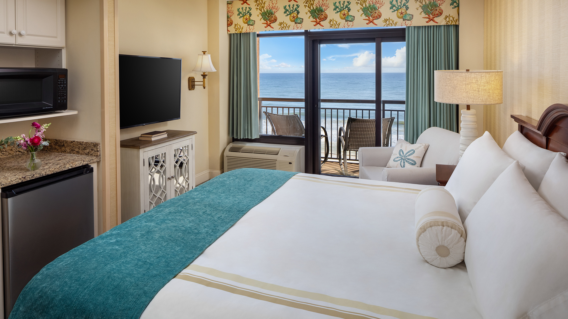 a room with a large bed and a television