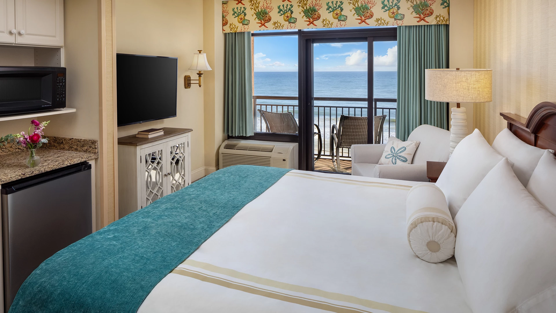 a room with a large bed and a television