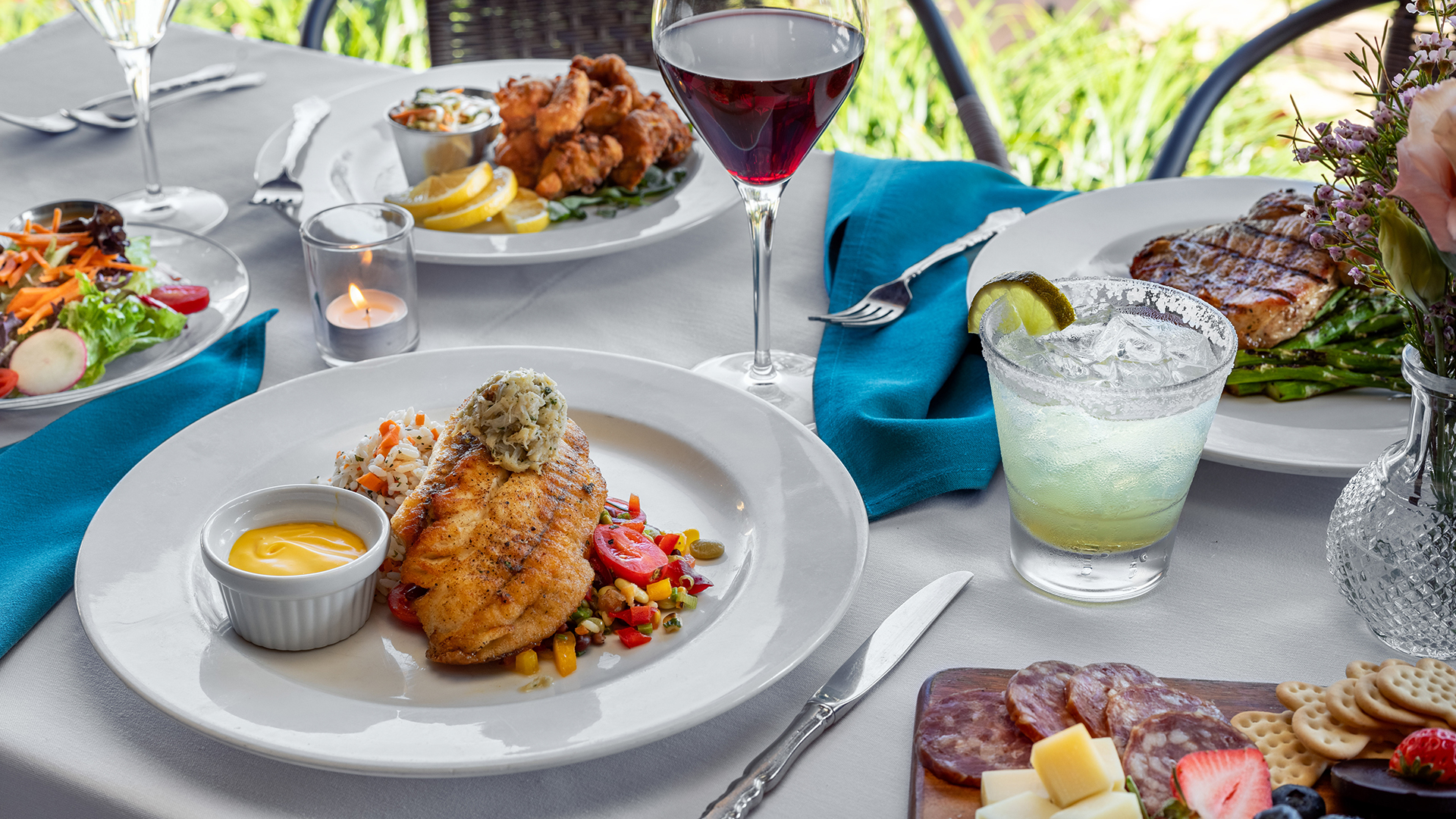 a plate of food and a glass of wine