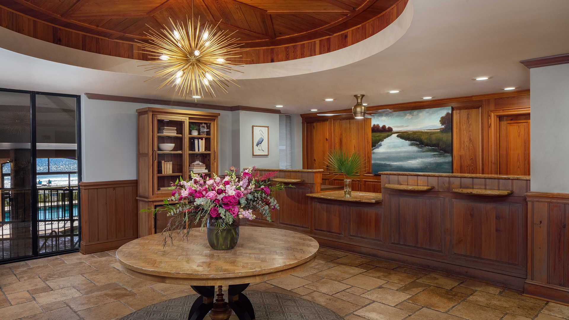 a room with a table and a vase of flowers