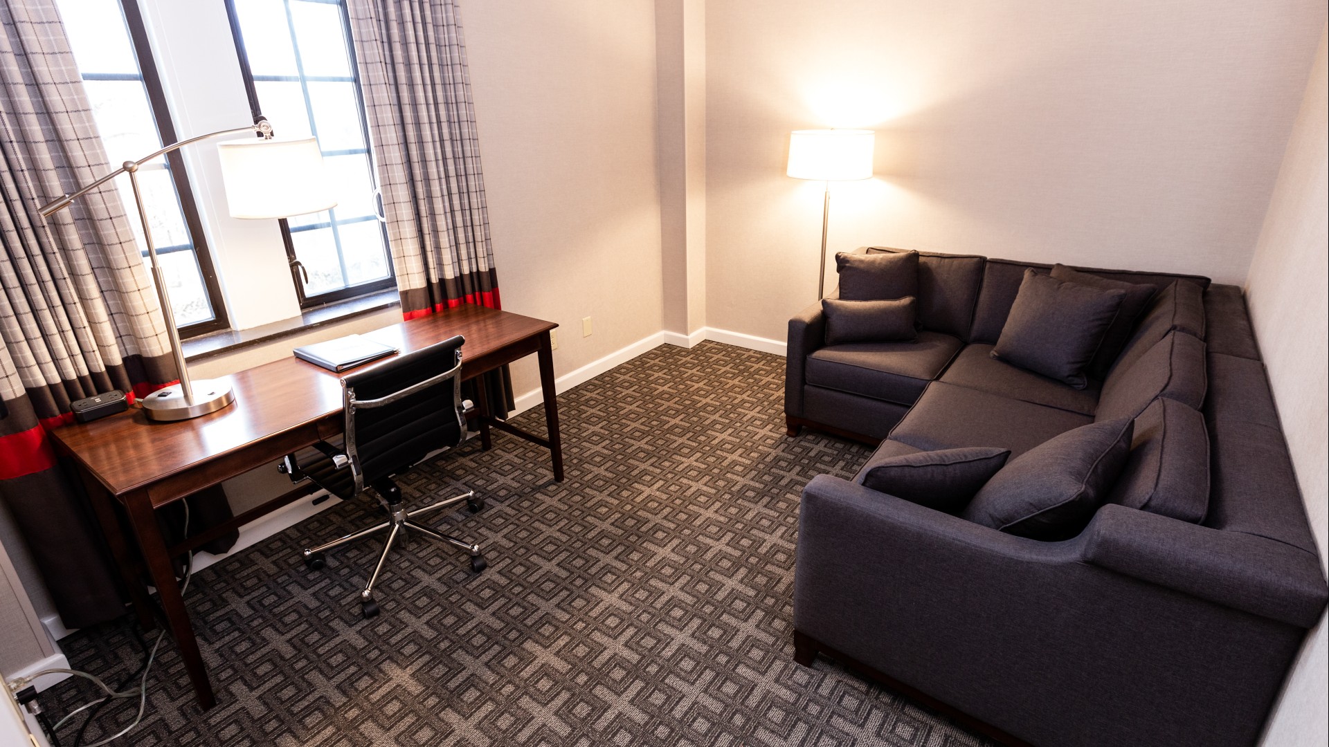 a room with a couch and a desk